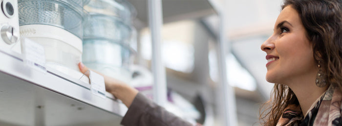 a woman shops for kitchen appliances