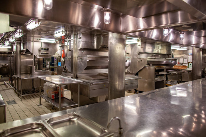 A commercial kitchen made mostly from stainless steel