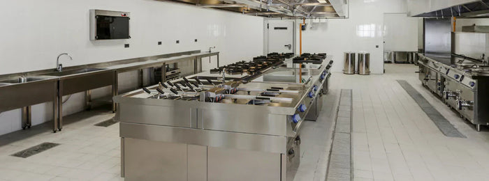  A hotel kitchen equipped with pots, pans, ovens, and other hotel equipment