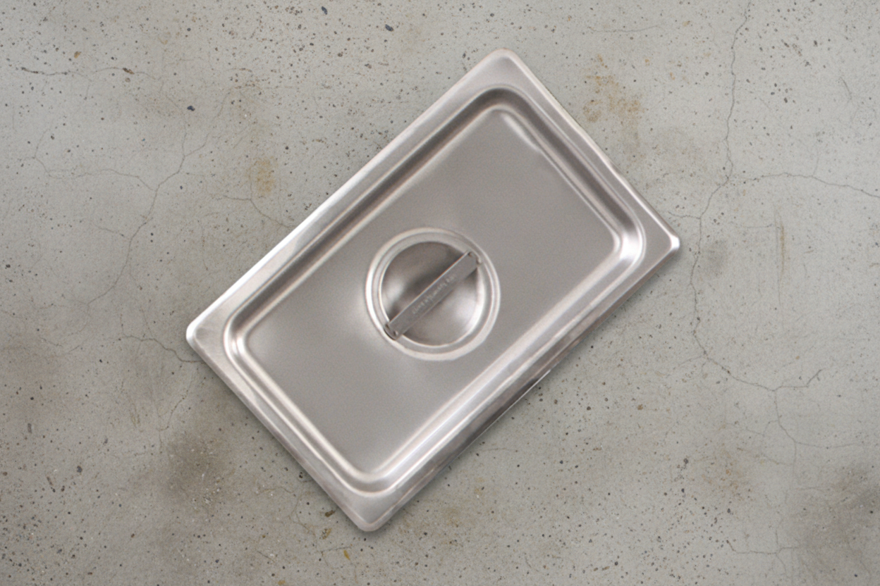 Browne CP2224L Lid Solid 1/2 Long Stainless Steel on white background facing up