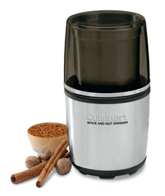 Cuisinart Spice & Nut Grinder on white background beside spices and nuts