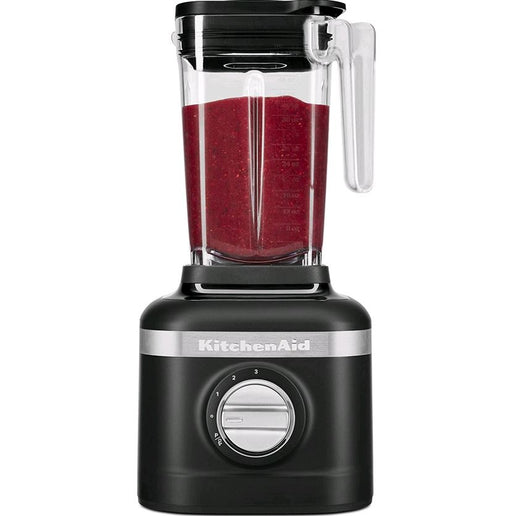 KitchenAid personal countertop blender filled with red smoothie in shade Black