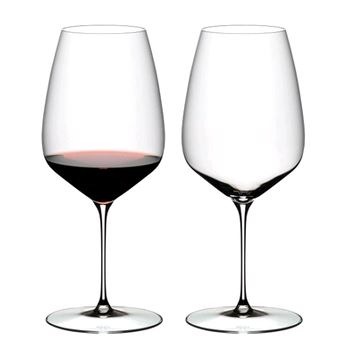 RIEDEL Veloce Cabernet Sauvignon 6330/0 set of two with one glass full and one empty on white bakground